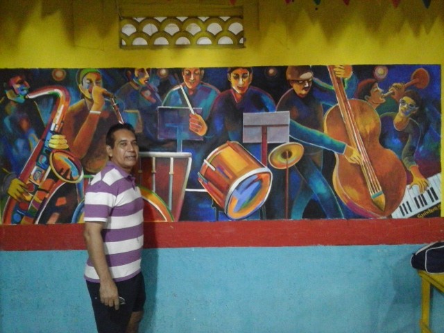 Mural pintado por Gustavo Quintero: “La Orquesta de La Cien”.