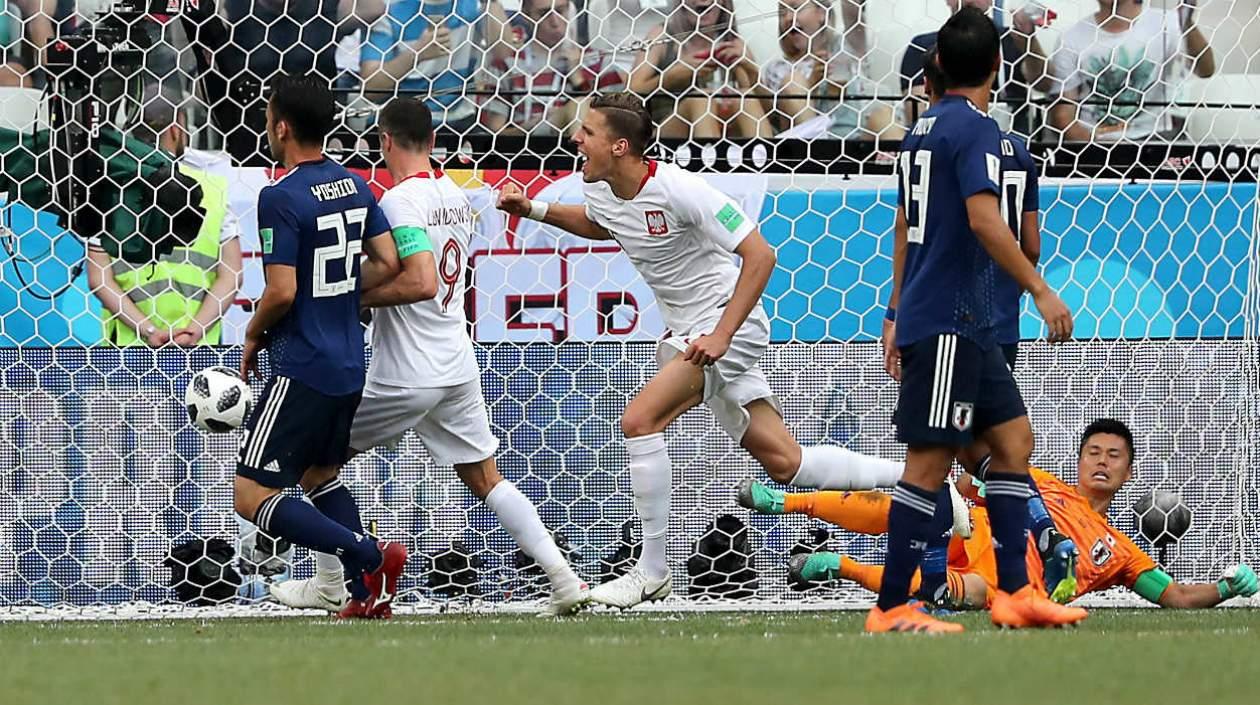 Jugadores de Polonia celebran el gol ante Japón. 