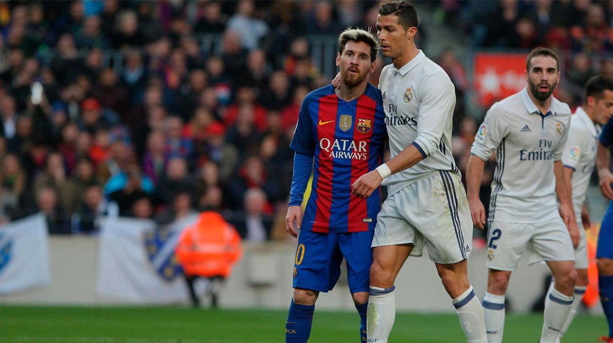 Cristiano Ronaldo y Lionel Messi en uno de sus duelos en la Liga Española. 