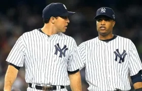 Mark Teixeira y Robison Canó en sus épocas como jugadores de los Yankees. 
