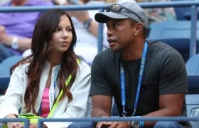 Erica Herman y Tiger Woods.