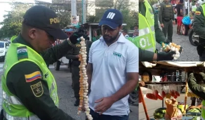La Policía y Barranquilla Verde hicieron los operativos de decomiso de las iguanas. En la foto, un policía y un veterinario.