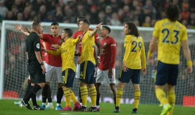 Acción del partido entre el Manchester United y el Arsenal. 