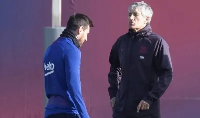 Lionel Messi y Quique Setién.