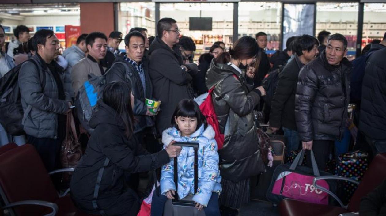 Viajeros chinos que regresan a sus ciudades de origen para Año Nuevo.