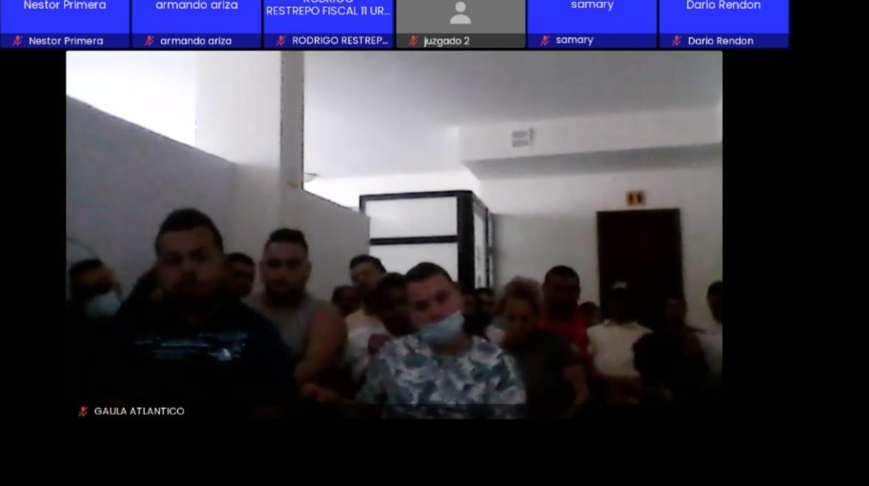 Los capturados durante la audiencia virtual de formulación de cargos. 