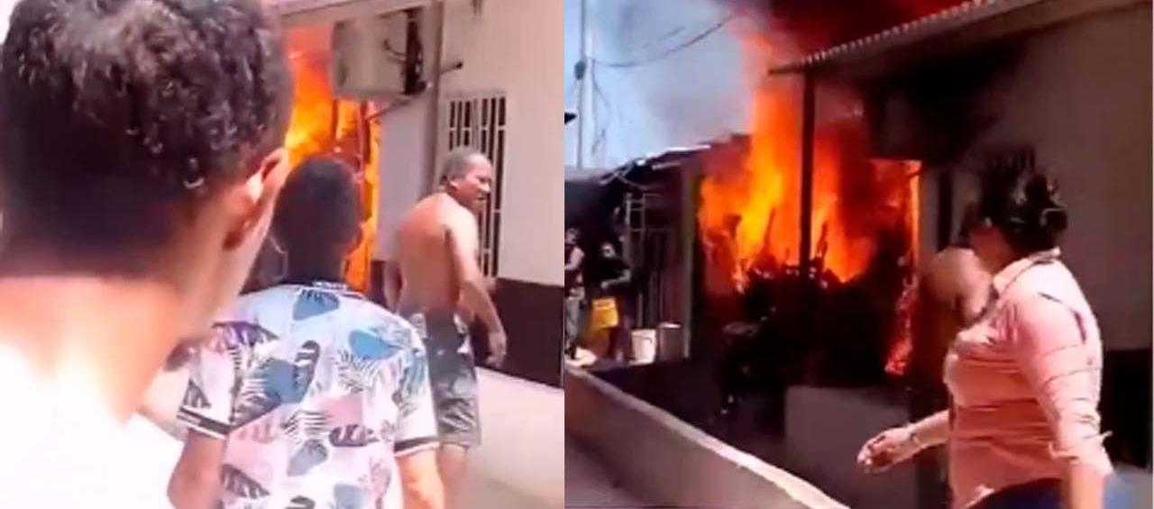 Vecinos de San Vicente observan las llamas que salen de una vivienda en la calle 50C con carrera 2D