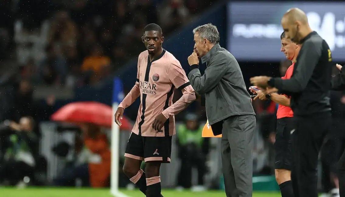 Ousmane Dembélé y Luis Enrique.