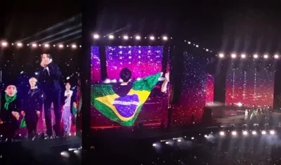 Uno de los integrantes de BTS con la bandera de Brasil.